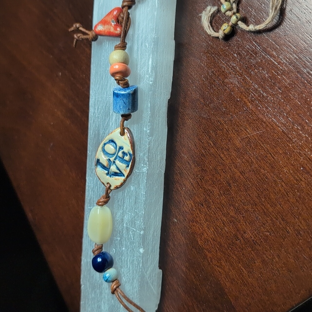 Ceramic bracelet and good luck amulet.